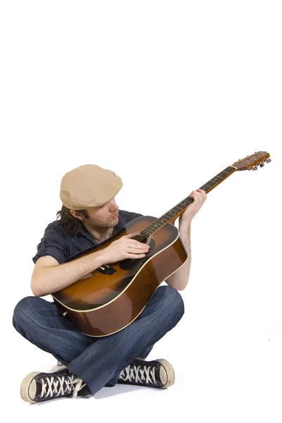 Seated guitarist — Stock Photo, Image