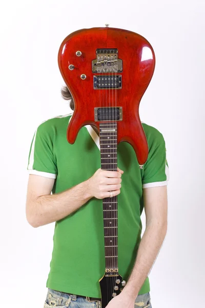 Guitarra sobre la cara — Foto de Stock
