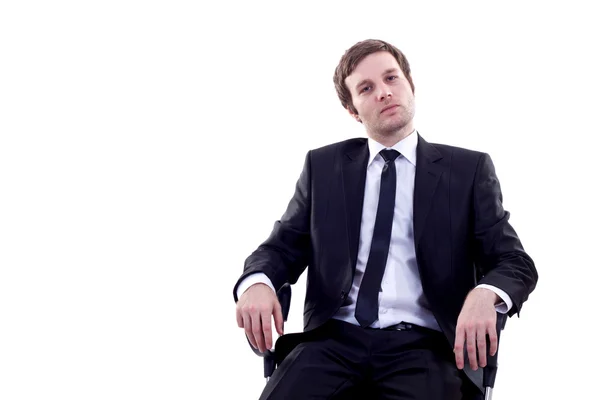 Man sits in office chair — Stock Photo, Image