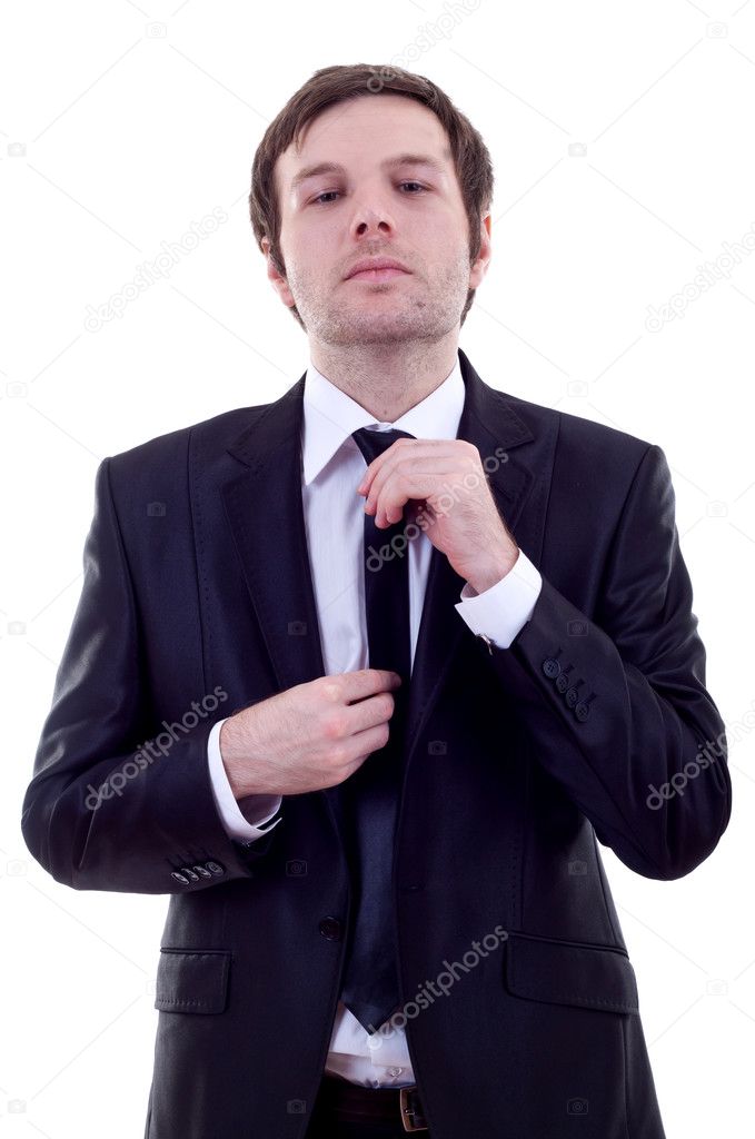 Man adjusting his tie