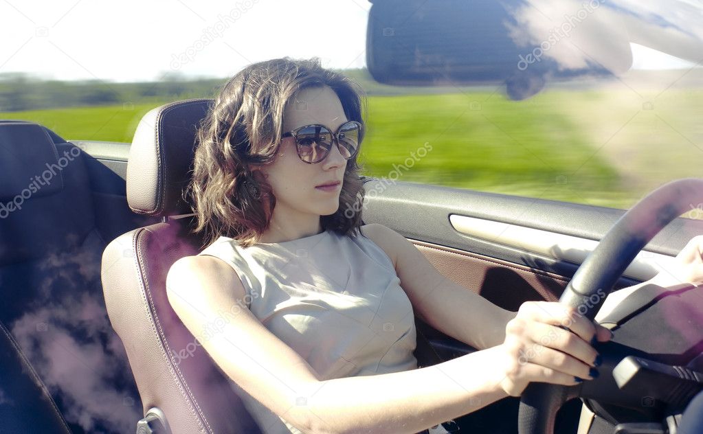 Young woman is driving