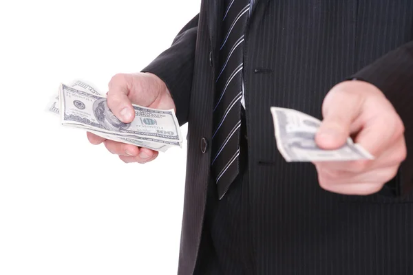 Бизнесмен держит в руках партию долларов — стоковое фото