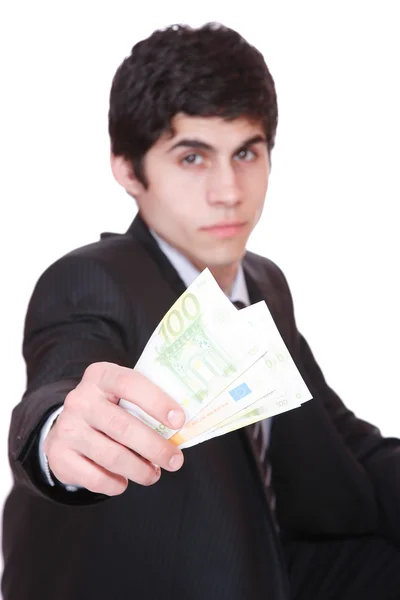 Empresário segurando lote de euros — Fotografia de Stock