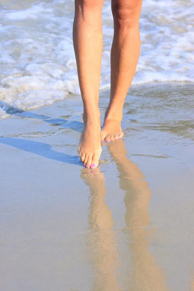Legs on a beach — Stock Photo, Image