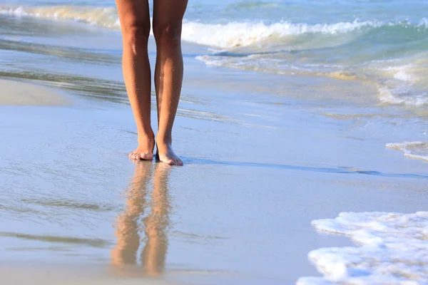 Legs on a beach — Stock Photo, Image