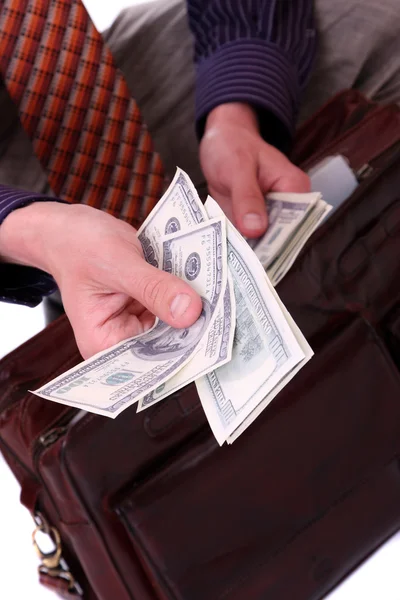 Geld in een zakenman handen — Stockfoto