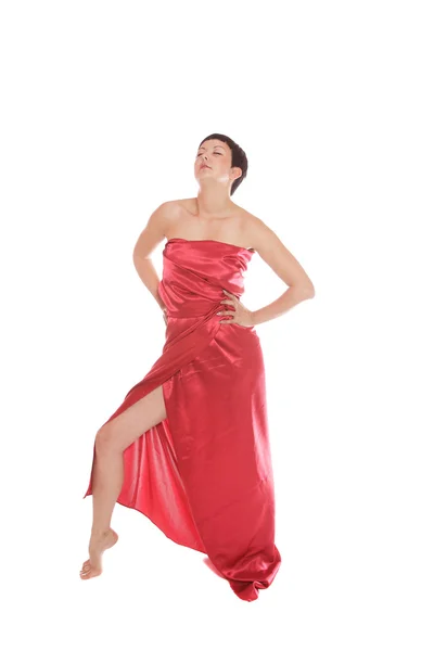 Schöne junge Frau im roten langen Kleid — Stockfoto