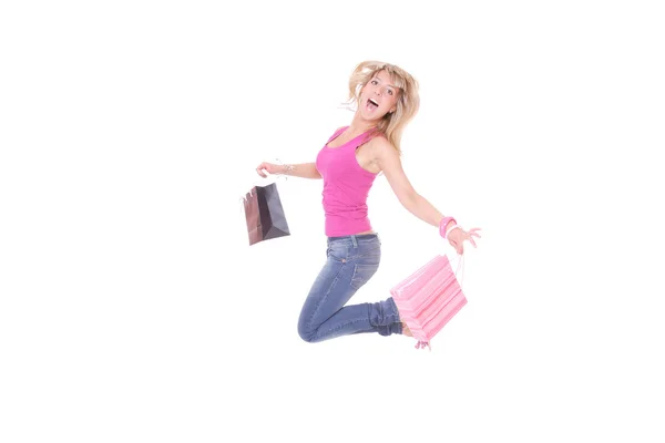 Žena skákání s nákupní tašky — Stock fotografie