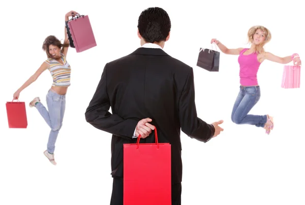 Homem de compras com duas meninas saltando — Fotografia de Stock