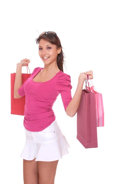 Mulher feliz com sacos de compras rosa — Fotografia de Stock