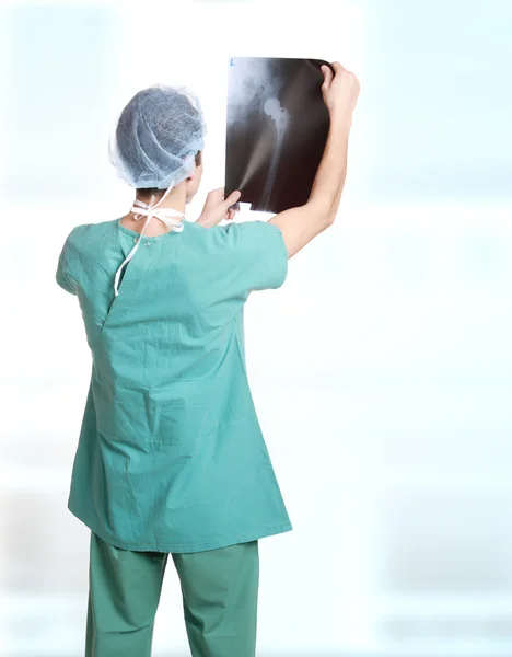 Doctor holding up xrays. — Stock Photo, Image