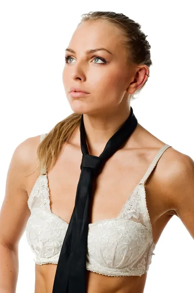 Mladá štíhlá žena nosí podprsenku na bílém pozadí — Stock fotografie