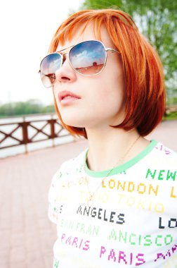 Young woman wearing sunglasses clipart