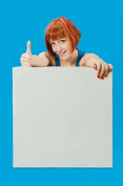 Beautiful red girl with blank board — Stock Photo, Image