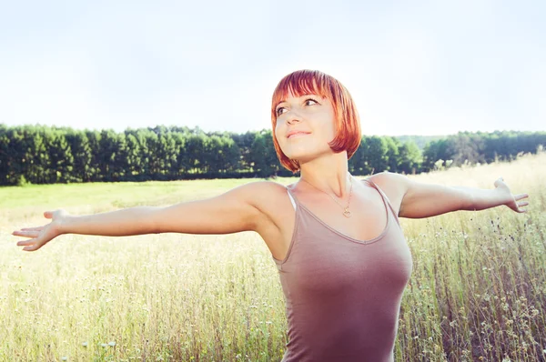 Happy red girl with outstretched hands — Stock Photo, Image