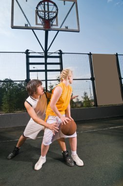 Teenagers playing basketball clipart