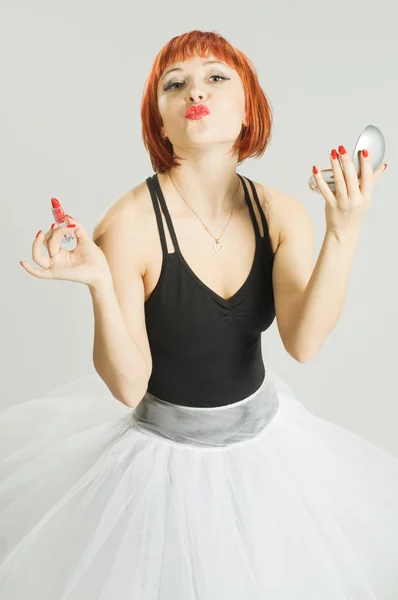 Red girl with lipstick and mirror — Stock Photo, Image