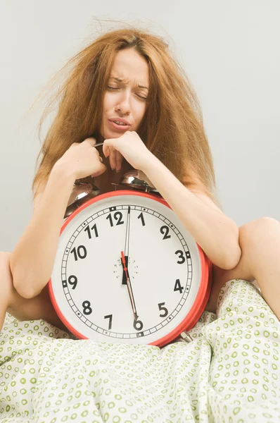 Woman in bed with alarm clock — Stock Photo, Image