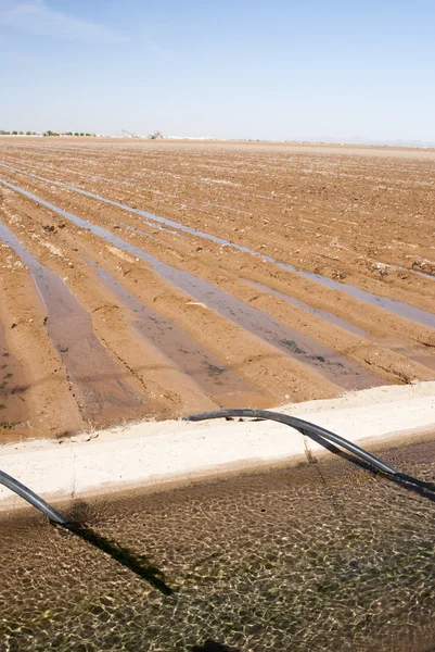 Irrigation canal & siphon tubes — Stock Photo, Image