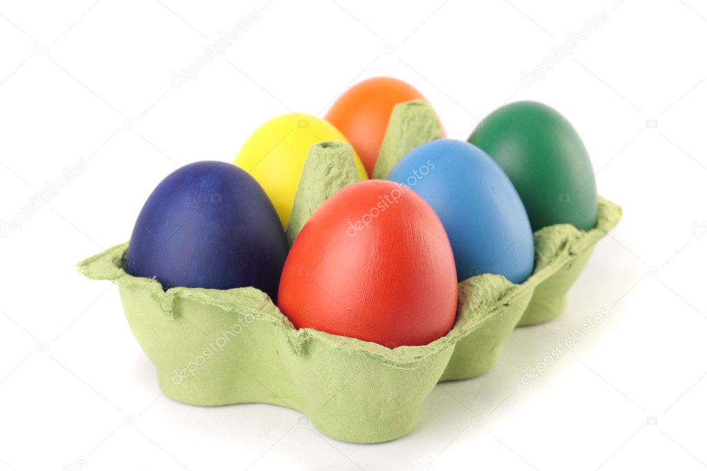 Easter eggs in carton over white