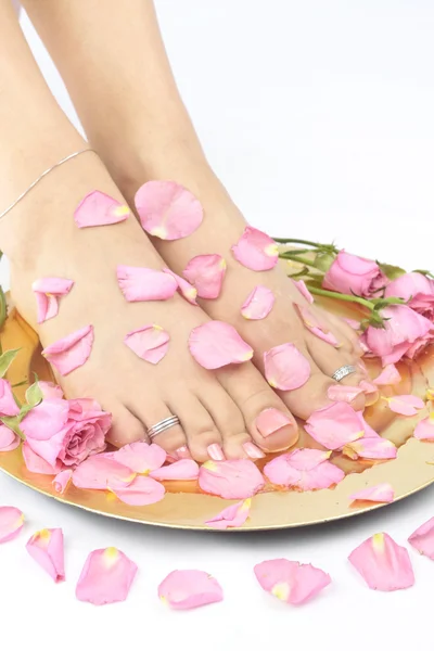 Woman feet with flowers and rose — Stock Photo, Image