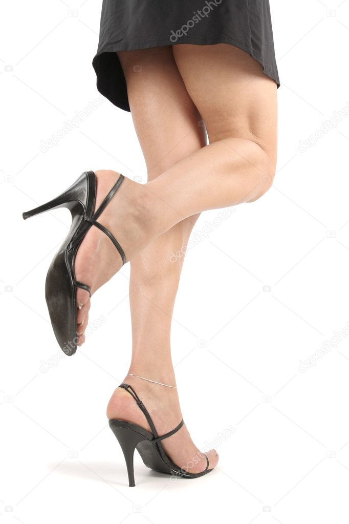 Woman legs and feet with black dress