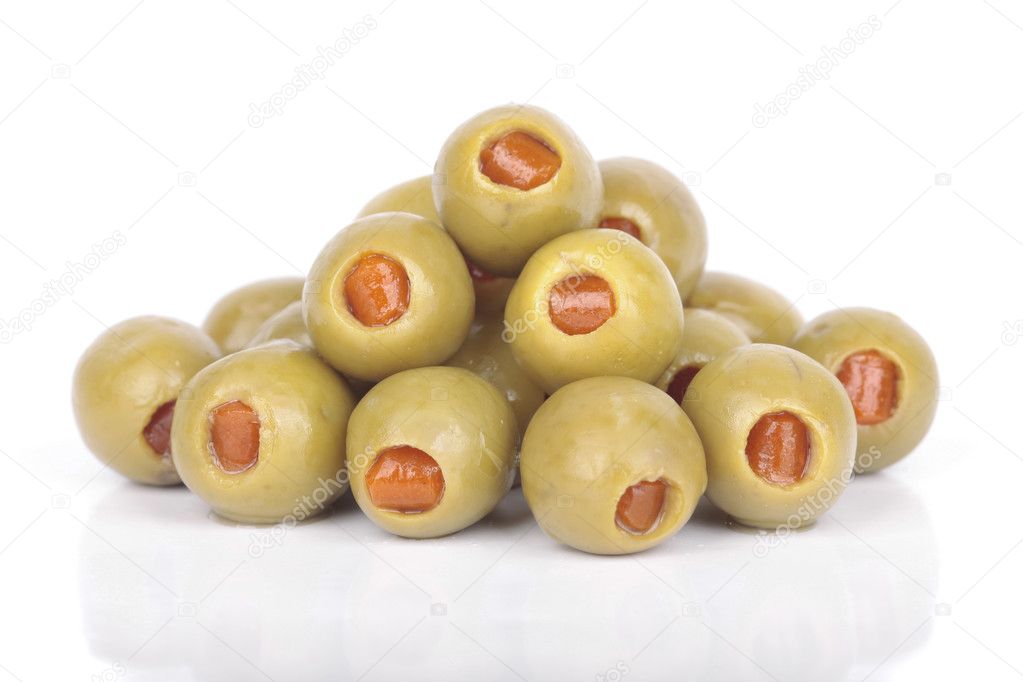 Stuffed olives closeup over white