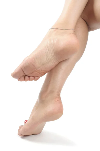 Donna piedi e gambe isolati su bianco — Foto Stock