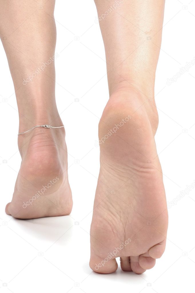 Woman feet over white background