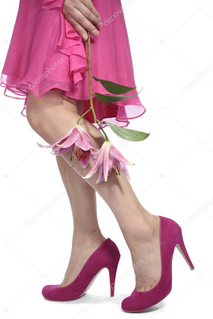 Woman feet wearing red heel shoes over white background