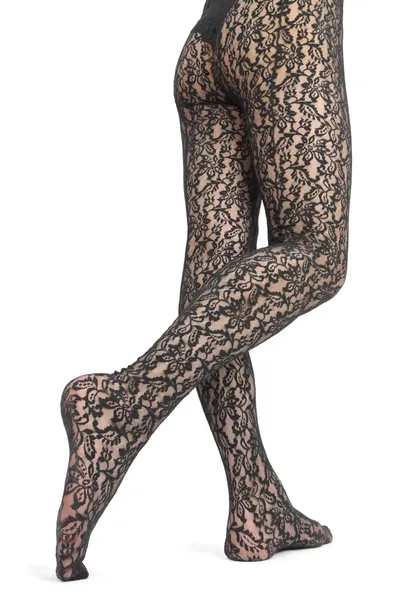 Сексуальные женские ноги и ноги с кружевными колготками на белом фоне — стоковое фото