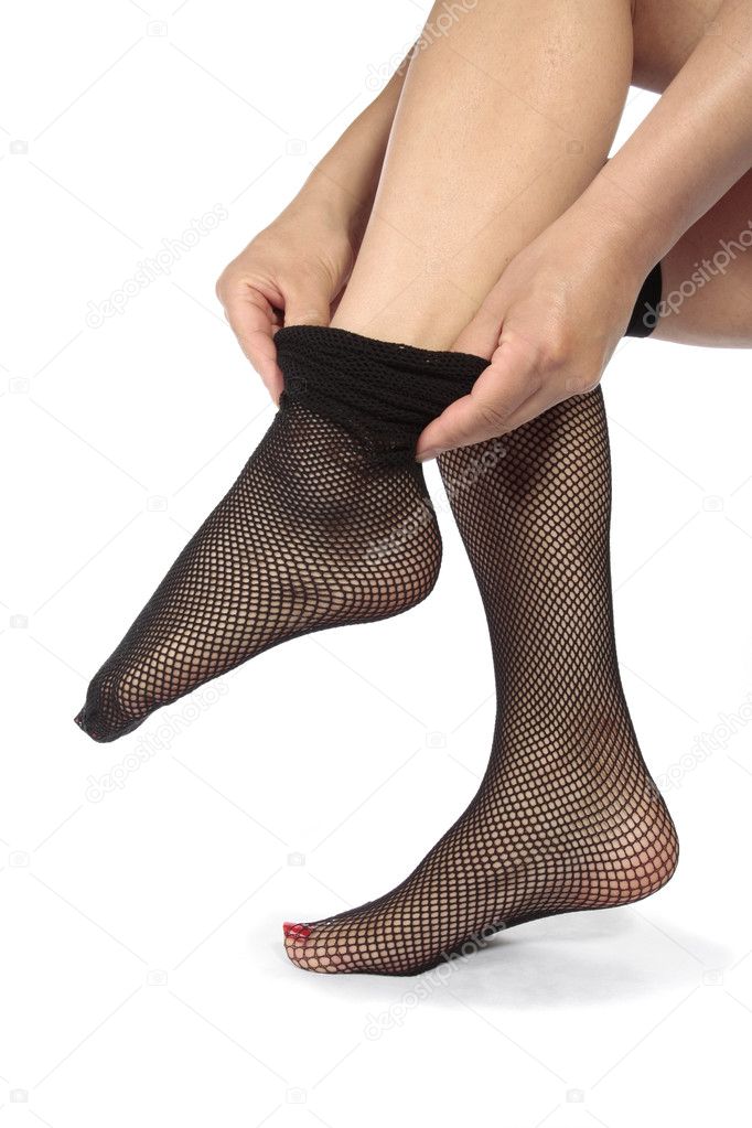 Woman legs putting on tights stockings over white background