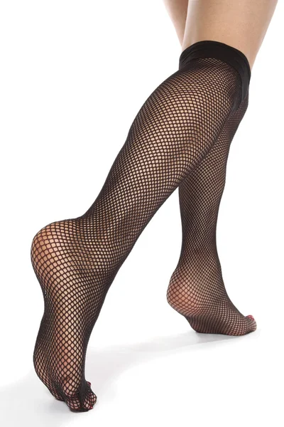 Woman feet with fishnet tights over white background — Stock Photo, Image