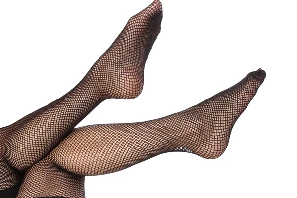 Donna piedi con calze a rete su sfondo bianco — Foto Stock