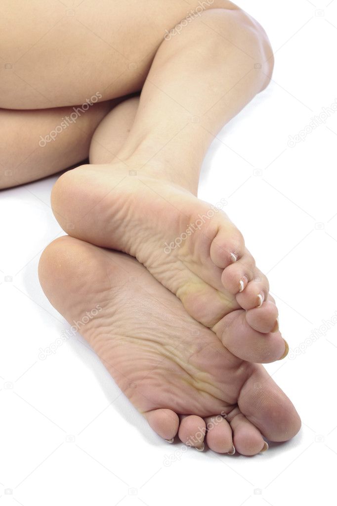 Woman feet isolated over white background