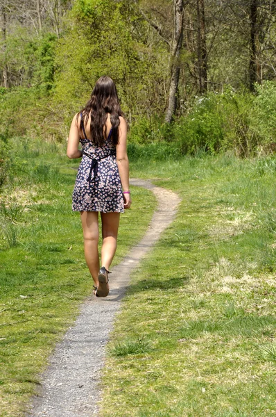 stock image Teen girl walking on a path