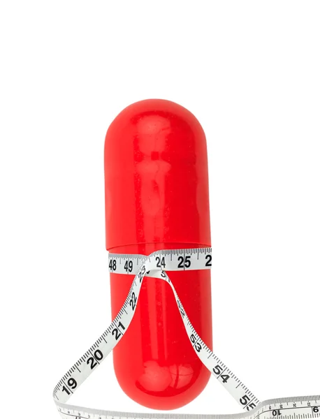 Stock image Isolated Diet Pill with Tape Measure