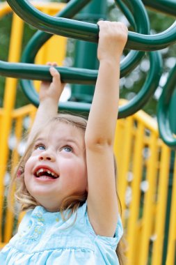 Child Crossing Monkey Bars clipart