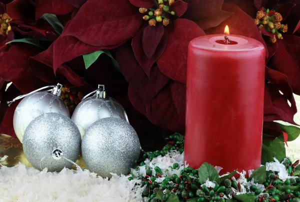 Christmas Candle and Poinsettias — Stock Photo, Image
