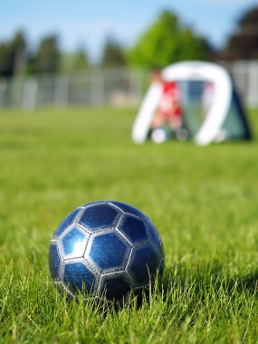 Blue Soccer Ball and Players