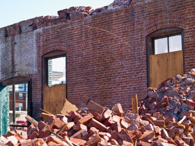 A demolition site with a pile of brick clipart