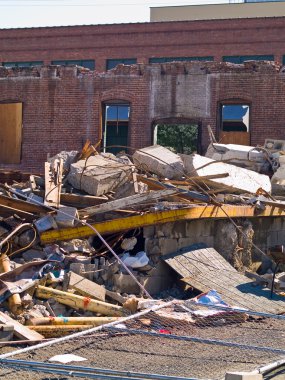 A demolition site with a pile of demolished bric clipart