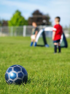 Blue Soccer Ball and Players