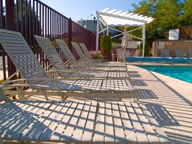 Lounge chair by the Pool clipart