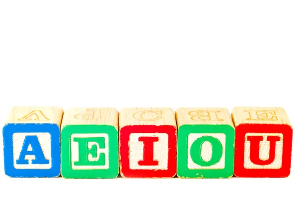 Colorful Alphabet Blocks With All of the Vowels — Stock Photo, Image