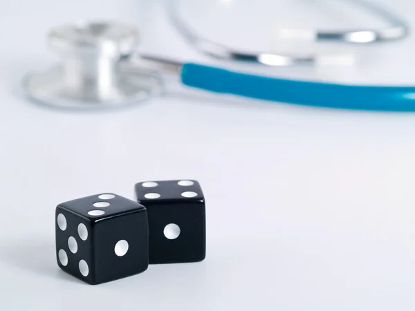 Stethoscope and Dice as a Gambling with your Health Concept — Stock Photo, Image
