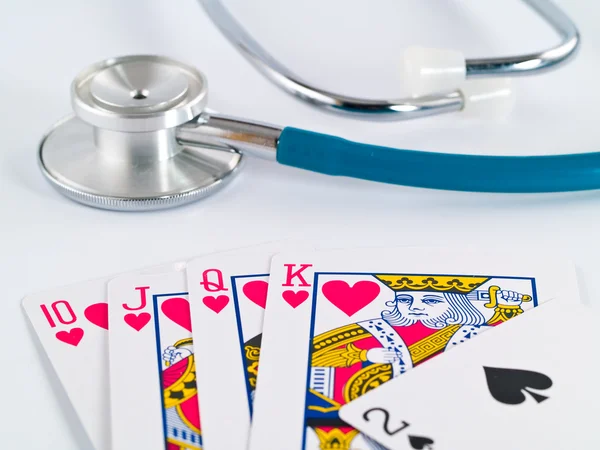 Stethoscope and Playing Cards as a Gambling with your Health Concept — Stock Photo, Image