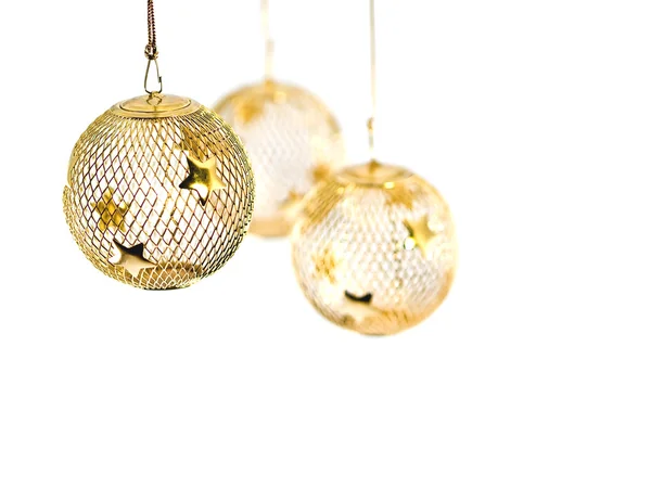 Golden Christmas ornaments isolated on a blank background — Stock Photo, Image