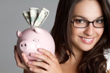 Girl Holding Piggy Bank clipart