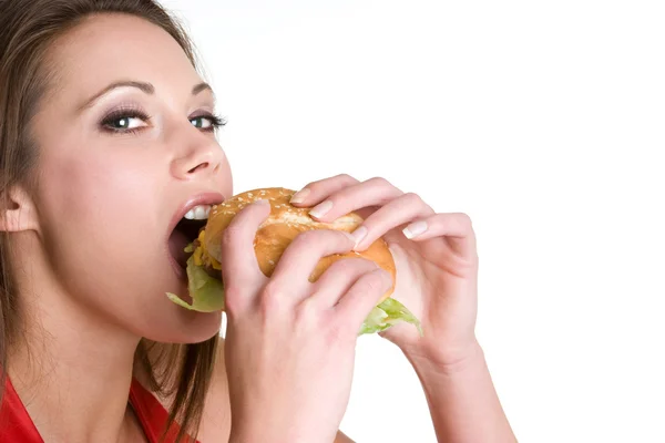 Donna che morde cibo — Foto Stock